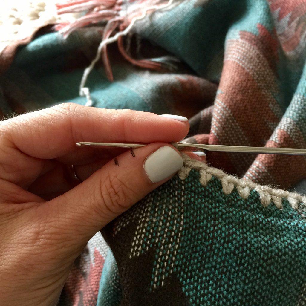 Adding a crochet border to fabric.
